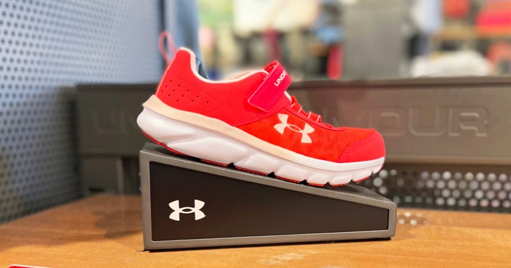 red under armour kids shoe on display in store