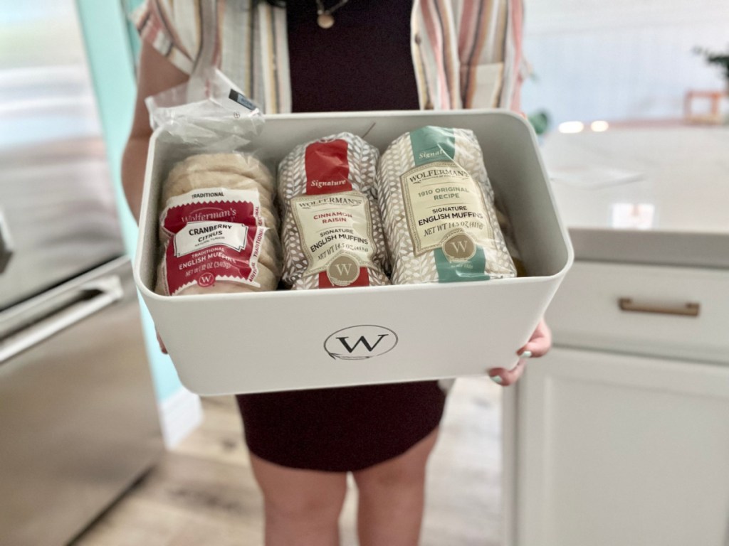 woman holding Wolfermans Breadbox Tin