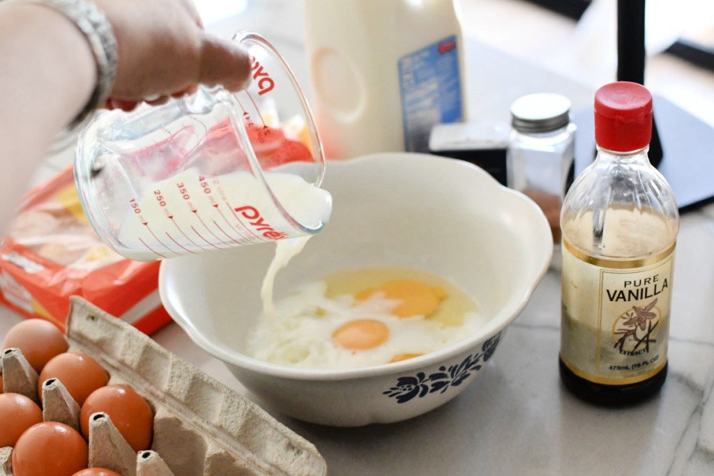 adding milk to eggs