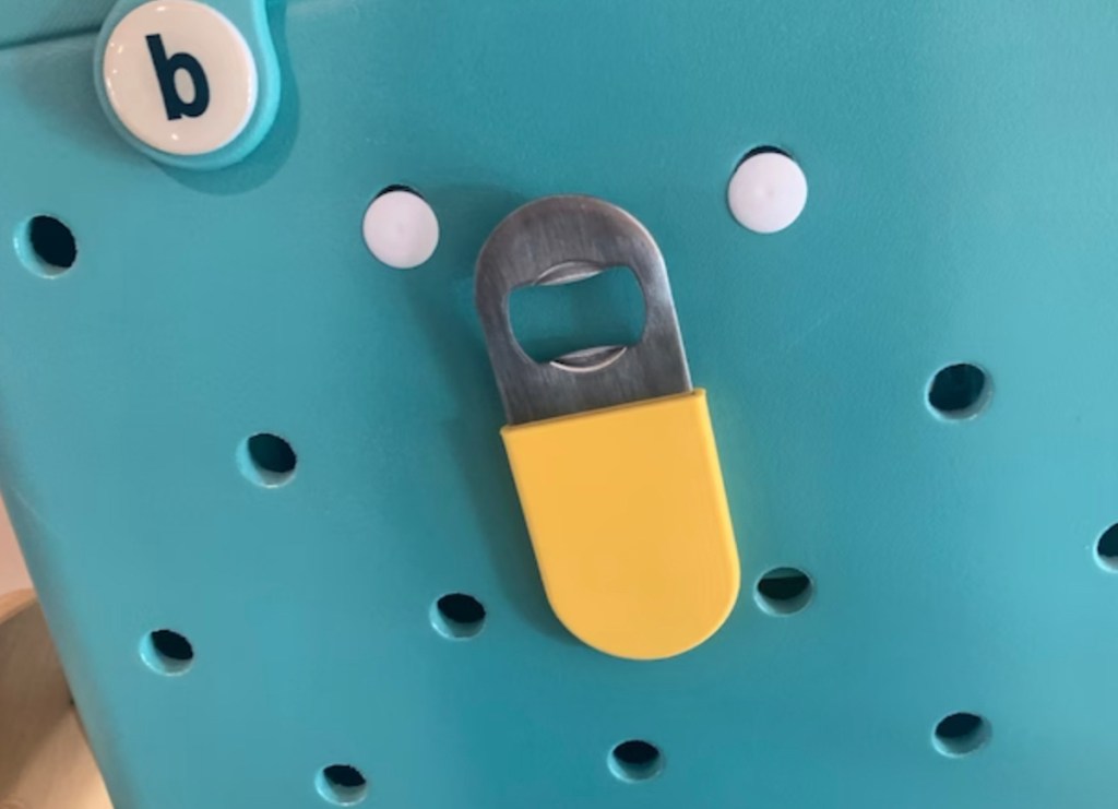 yellow bogg bag accessory bottle opener on blue bogg bag