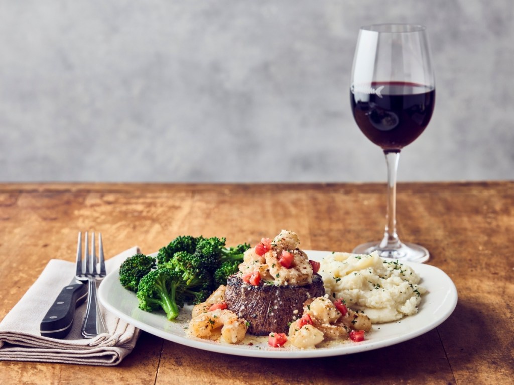 surf and turf meal with wine