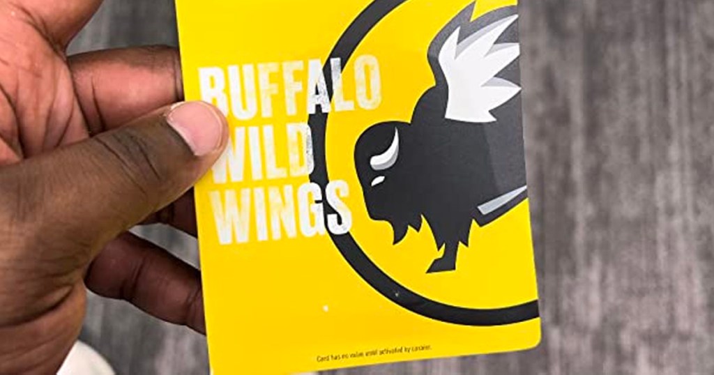 hand holding buffalo wild wings gift card