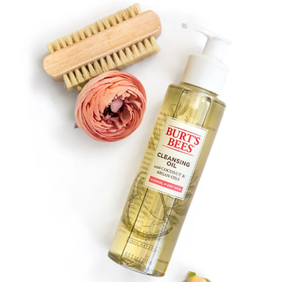 cleansing oil next to scrub brush