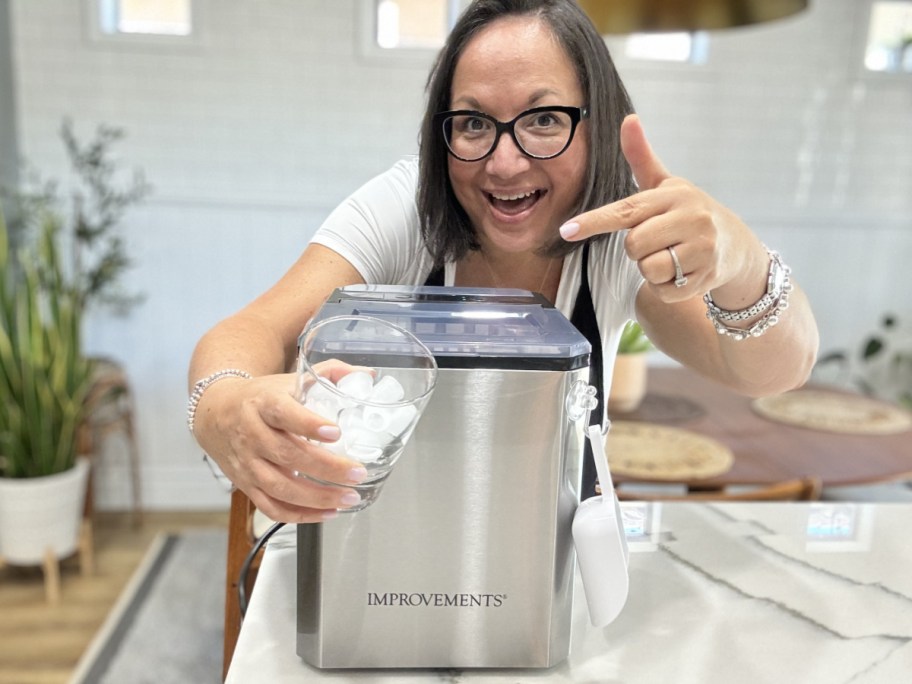 woman pointing to cup and ice maker