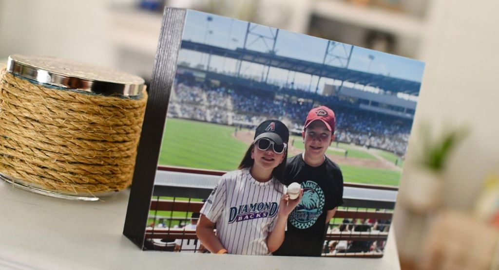 picture of girl and boy at baseball game