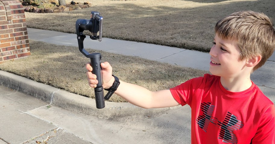 child holding phone stablizer 