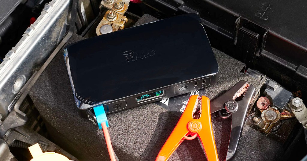 black halo portable starter with jumper cables plugged in