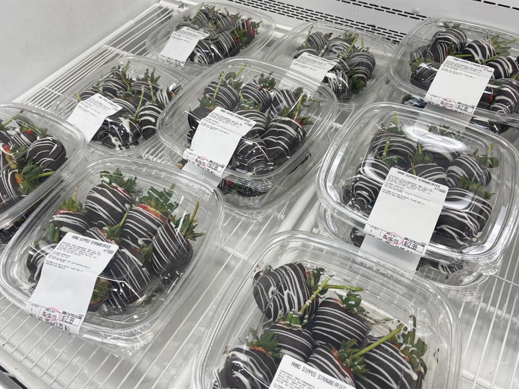 containers of hand dipped strawberries in cooler
