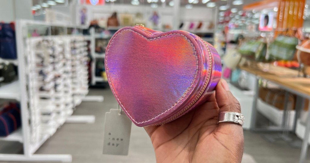 holding a heart-shaped jewelry organizer