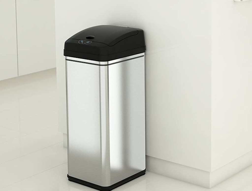 Black and stainless steel trash can in a kitchen