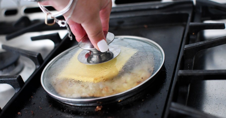 melting cheese over a smash burger