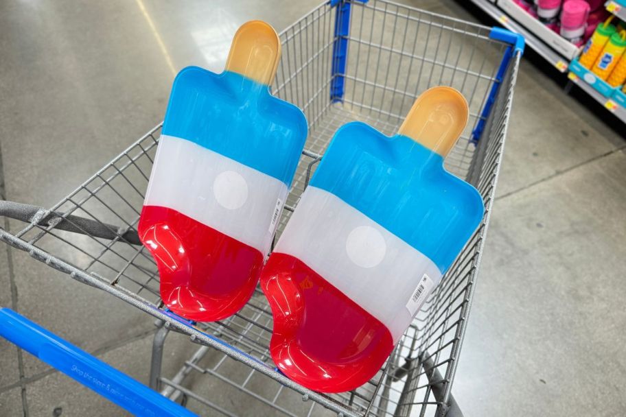 two plastic ice pop shaped serving trays in a walmart cart