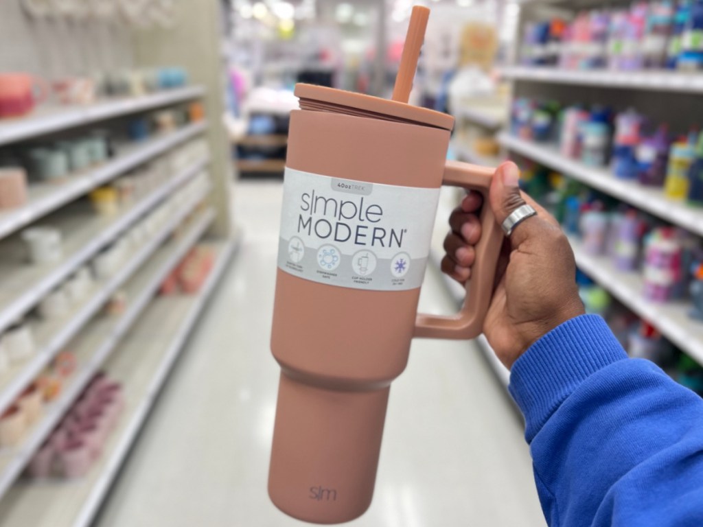 simply modern tumbler in beige in woman's hand at the store