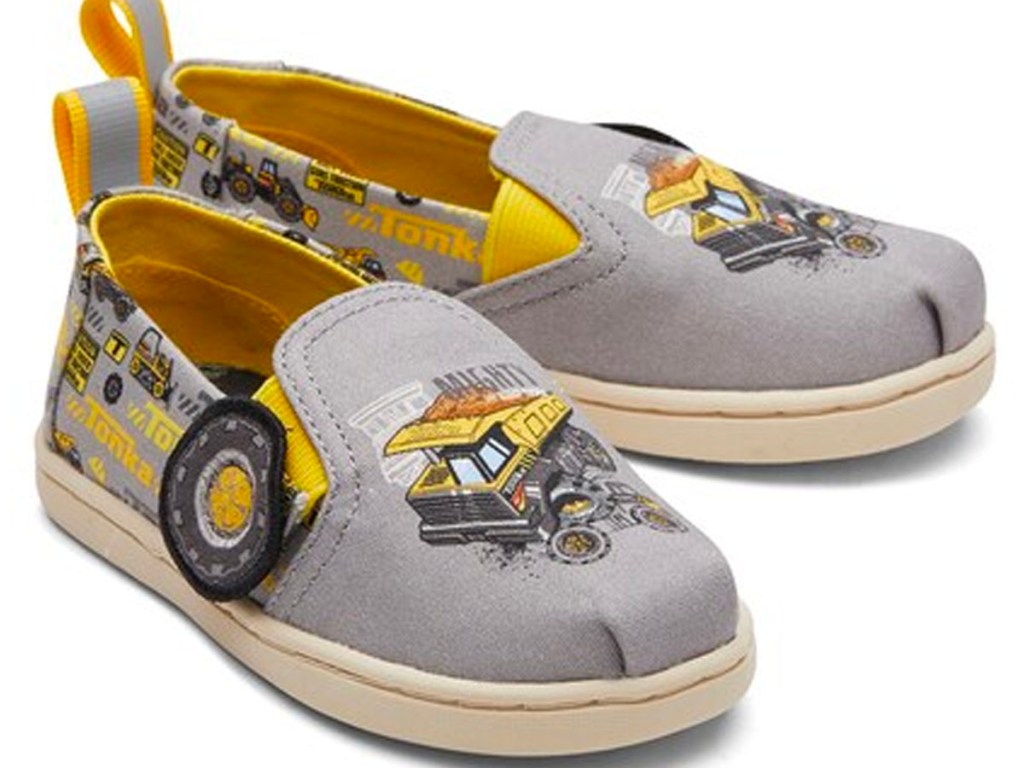 gray and yellow tonka toms shoes stock image