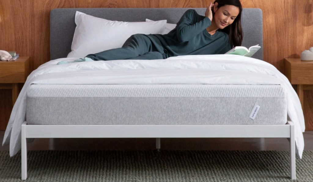 woman laying on mattress