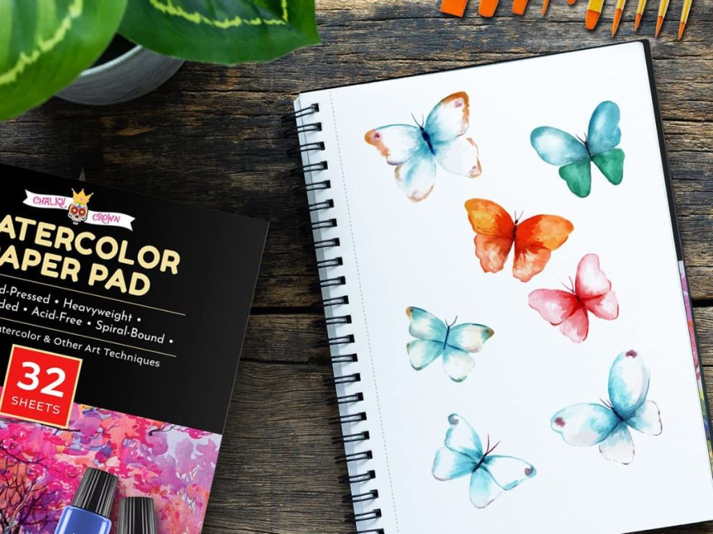 watercolor pad with watercolor butterflies painted on pad paper