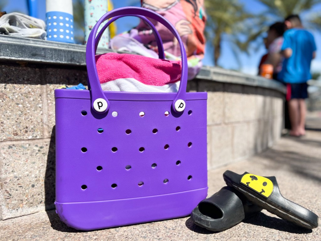 Waterproof Beach Bag from Temu sitting by a pool