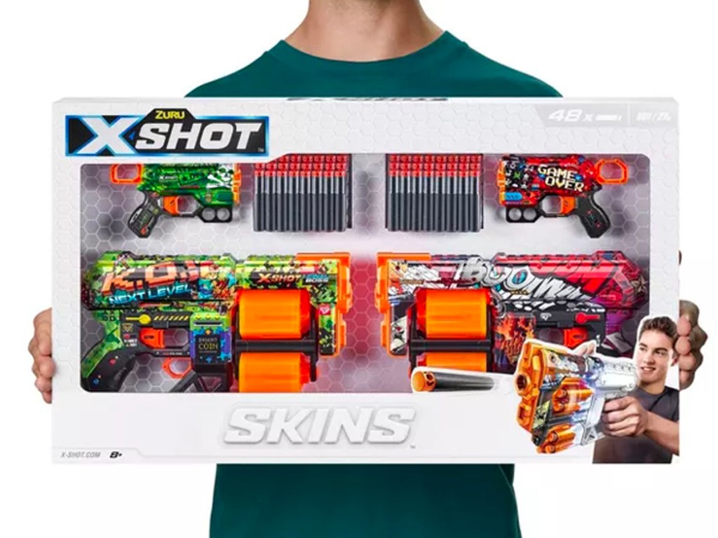 kid holding xshot blaster combo box