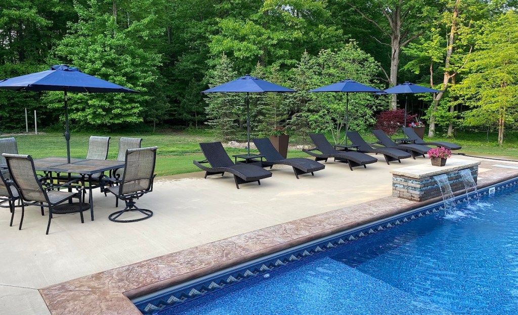 Pool and patio chairs with umbrellas
