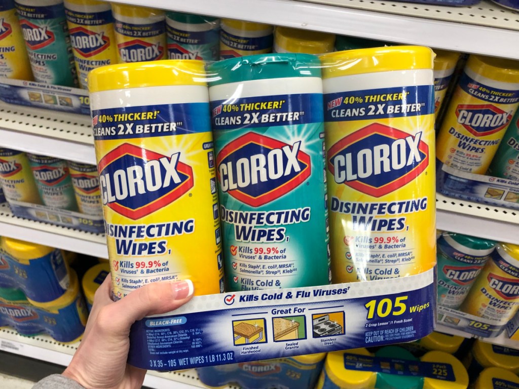 woman holding up Clorox Wipes Value Pack in store
