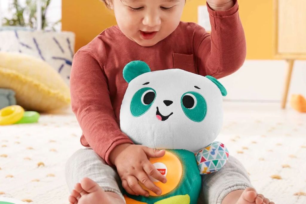 Little boy with Fisher-Price Linkimals Baby & Toddler Toy Play Together Panda Plush