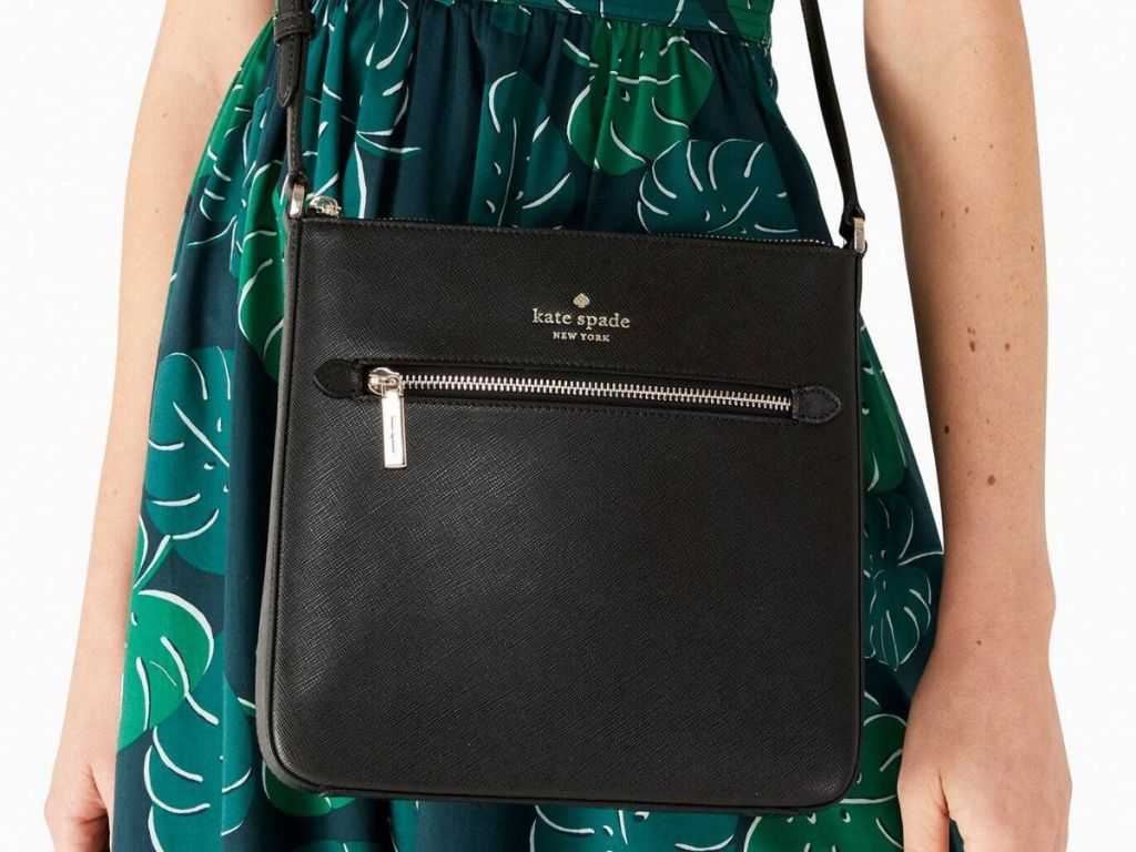 Woman wearing a Kate Spade Sadie Bag