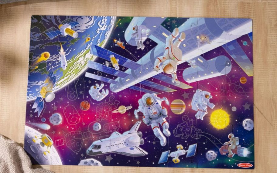 a kids glow in the dark outer space themed floor puzzle 