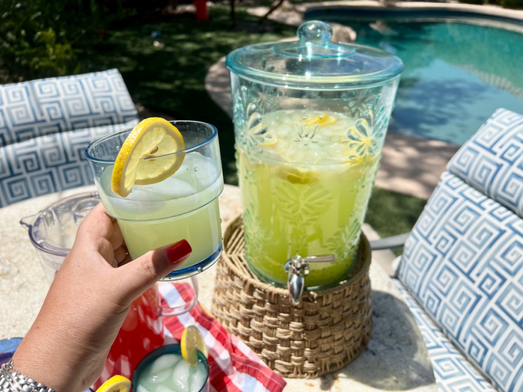 Pioneer Woman Acrylic Beverage Dispenser filled with lemonade at a backyard party