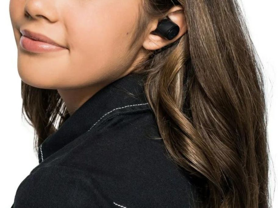 Woman wearing Skullcandy Jib earbuds