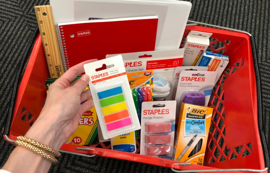 A cart with Staples school supplies and Staples back to school sale items