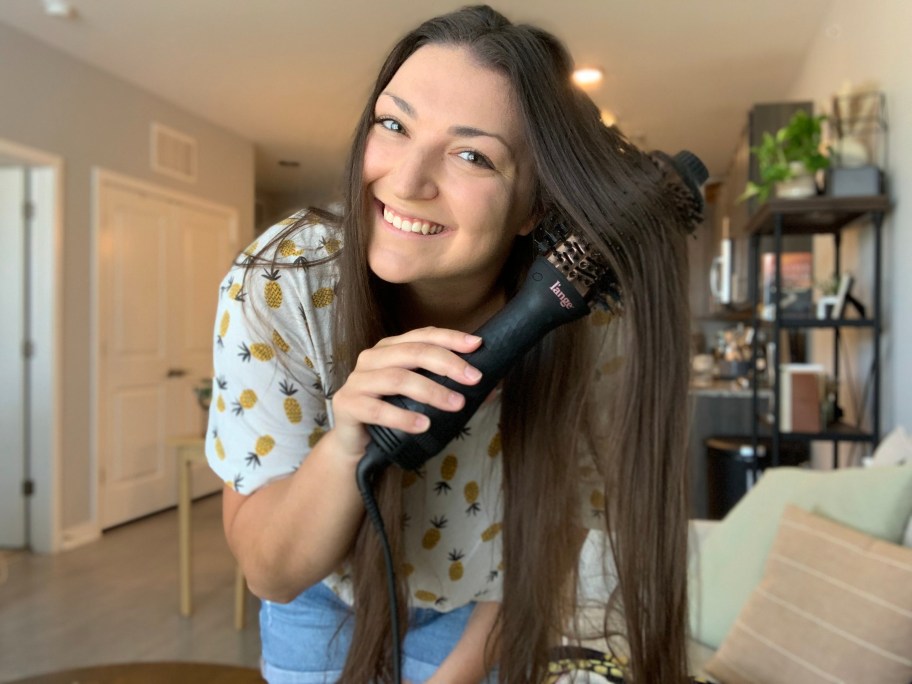 woman using a L'ange Le Volume Hair Dryer Brush