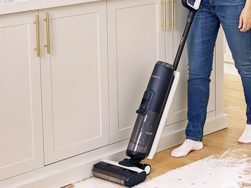 Person using a Tineco vacuum