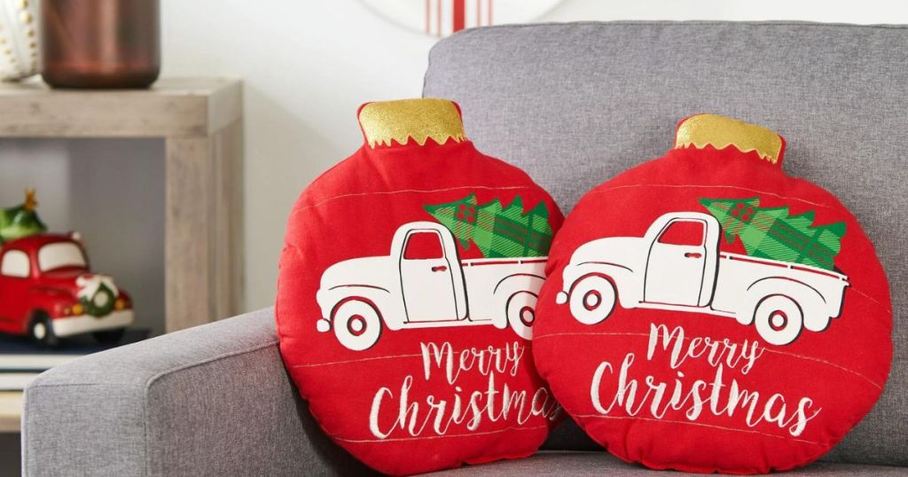 2 Walmart Christmas throw pillows in red with trucks and Christmas trees on them 