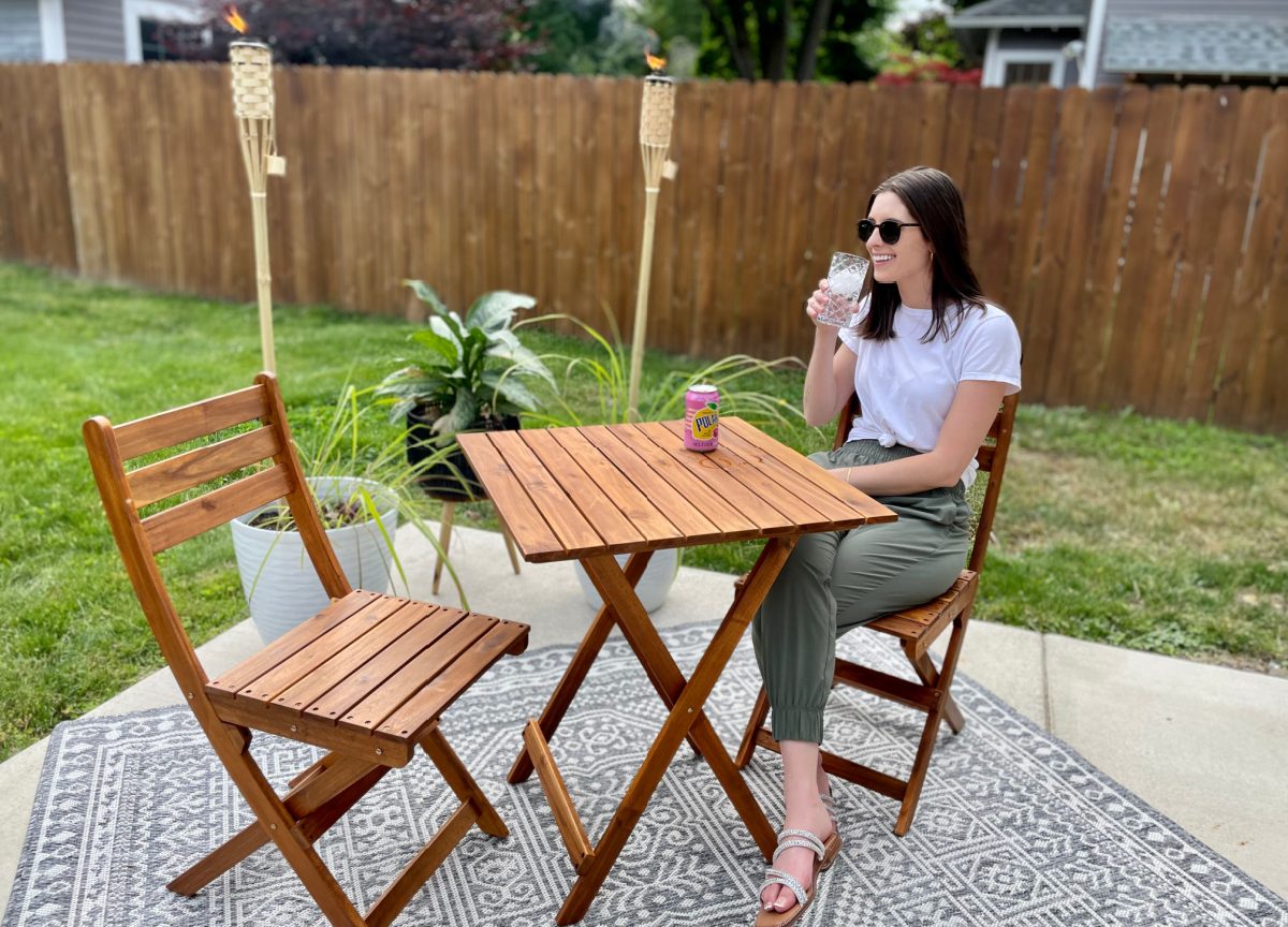 Woman enjoying her new Walmart patio furniture