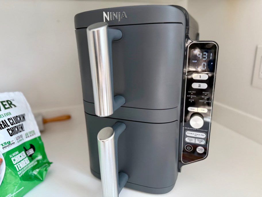 dark grey air fryer with two stacked baskets
