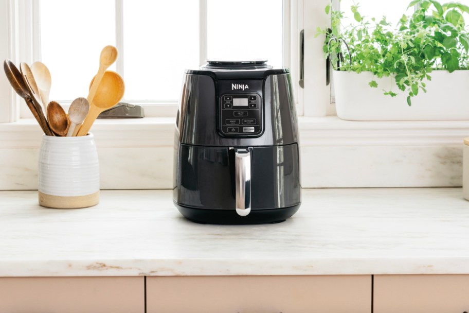 black ninja air fryer on white counter