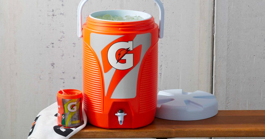 orange gatorade cooler on bench