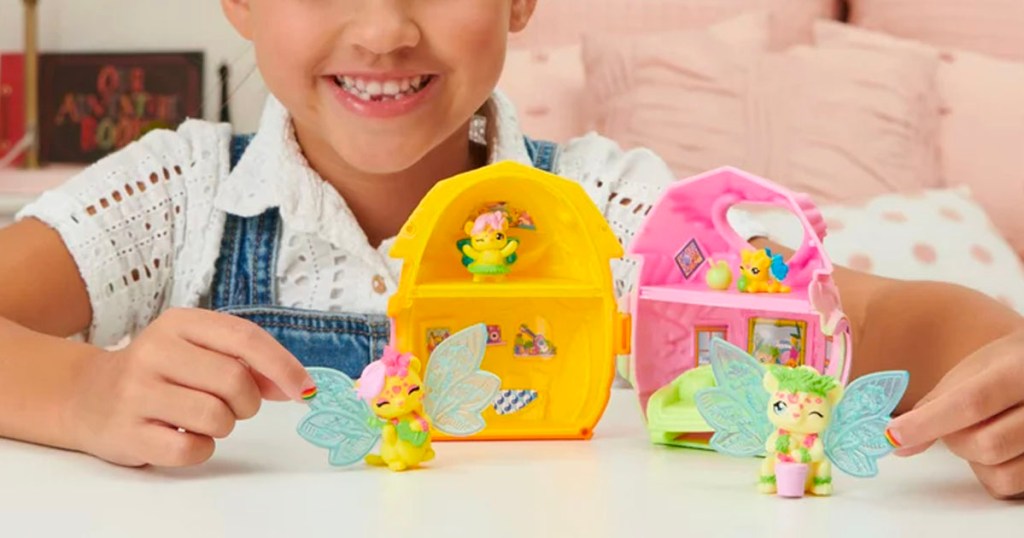 girl playing with colleggtibles toys