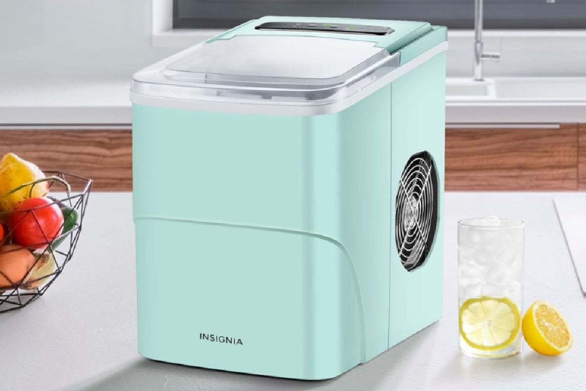 mint colored ice maker on white counter