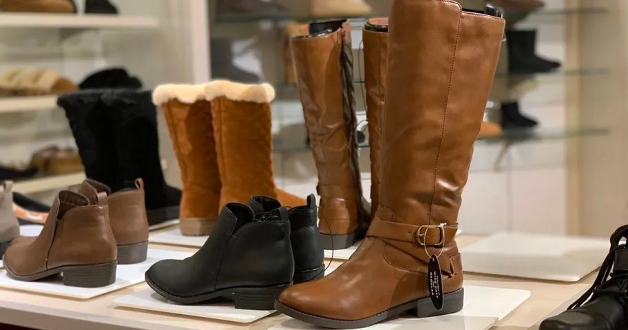 brown and black boots on display in macys store