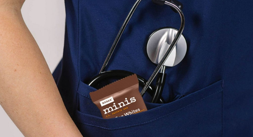 mini protein bar in nurses pocket with and doctor tool