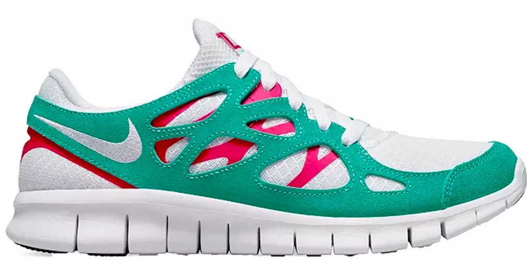teal, pink and white nike running shoes stock image