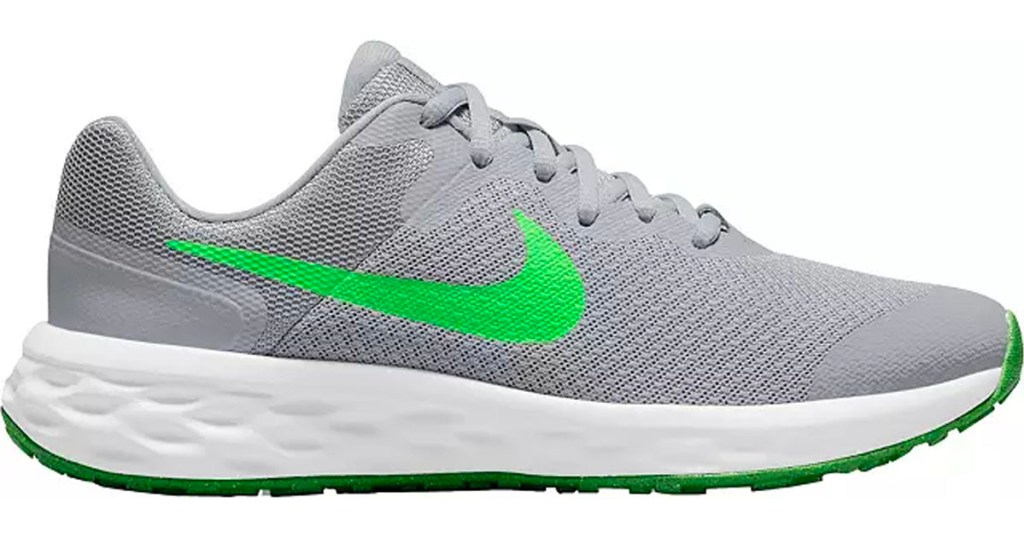 green and gray kids running nike shoes