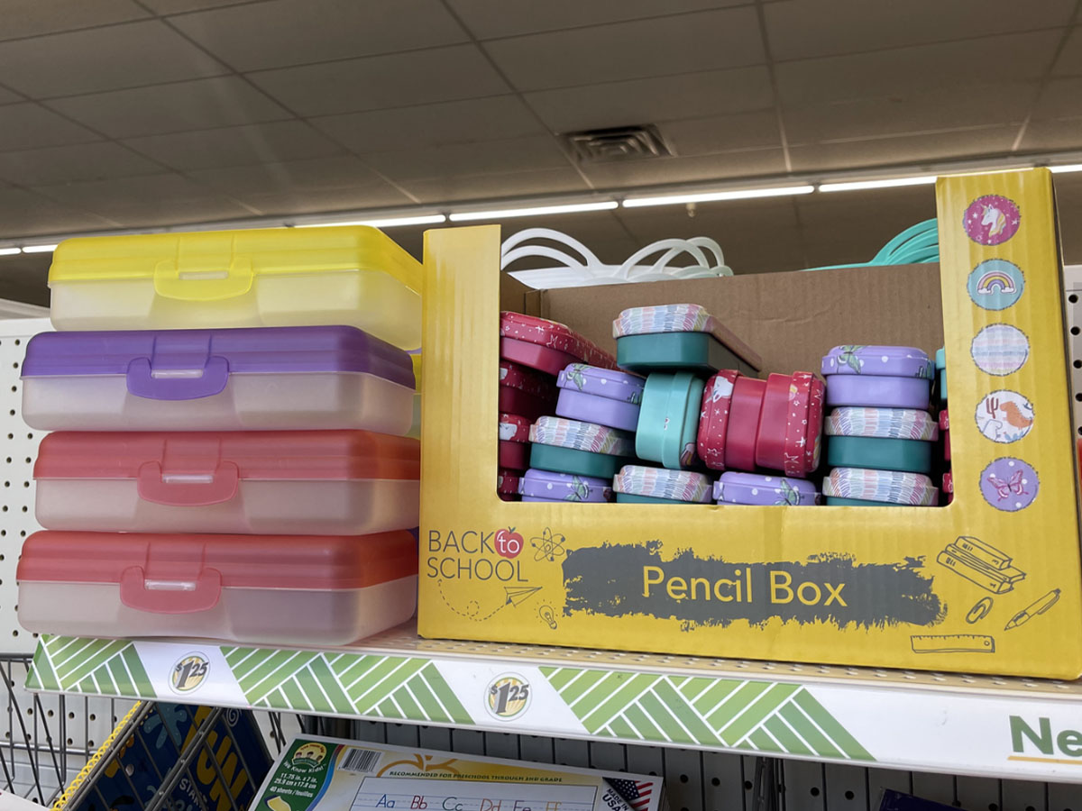 pencil boxes stacked on shelf