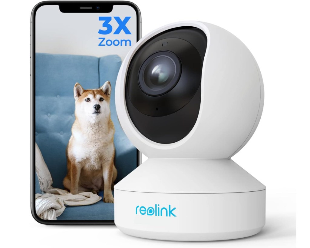 white sphere indoor security camera next to phone