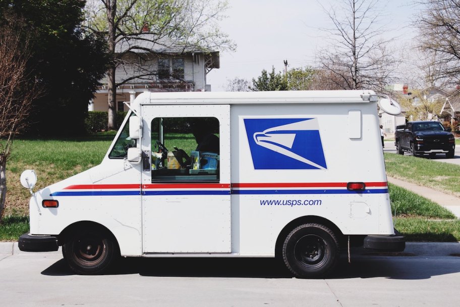 usps mail truck parked on side of street