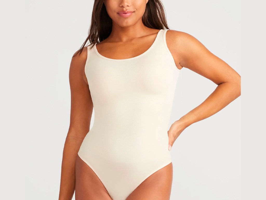 woman wearing yummie beige body suit