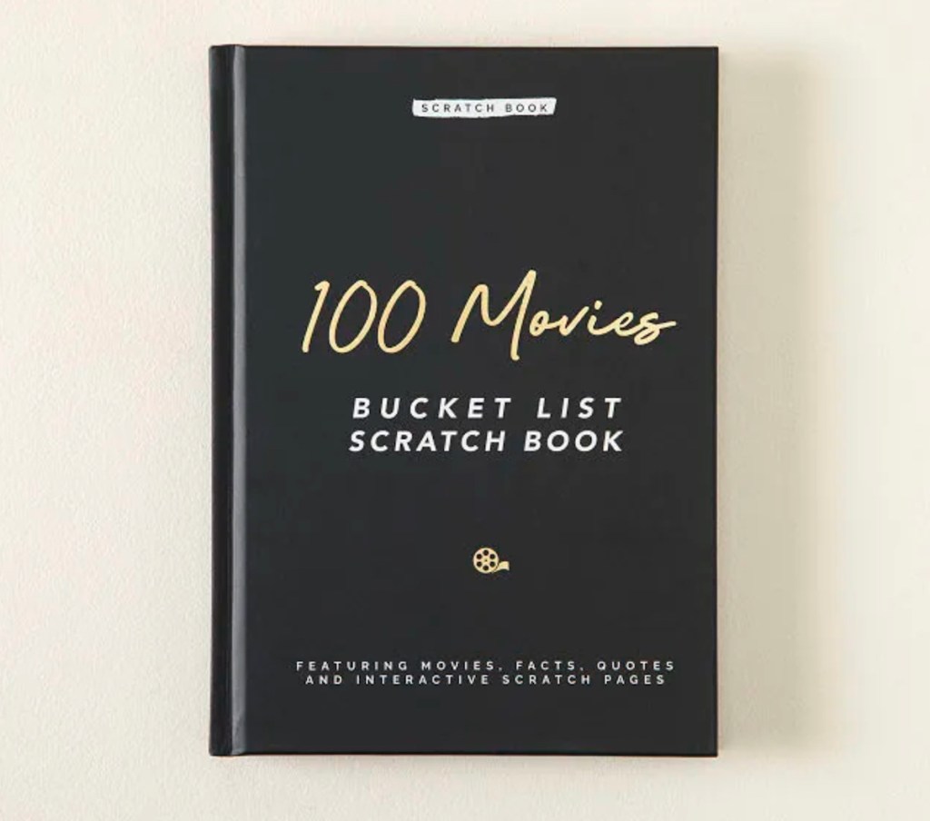 100 Movies Scratch Off Bucket List Book on cream background