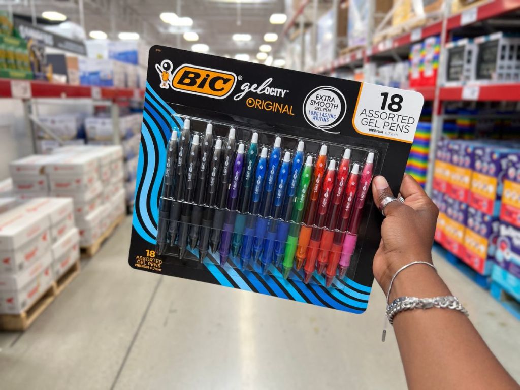 hand holding BIC pens in store