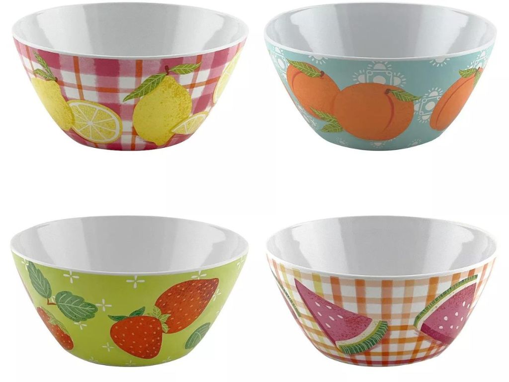 4 cereal bowls with fruit on them 